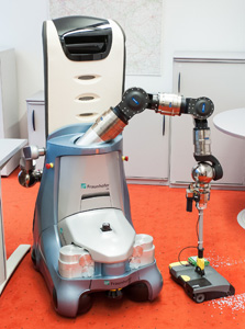 Putzroboter beim Staubsaugen Putzroboter beim Staubsaugen